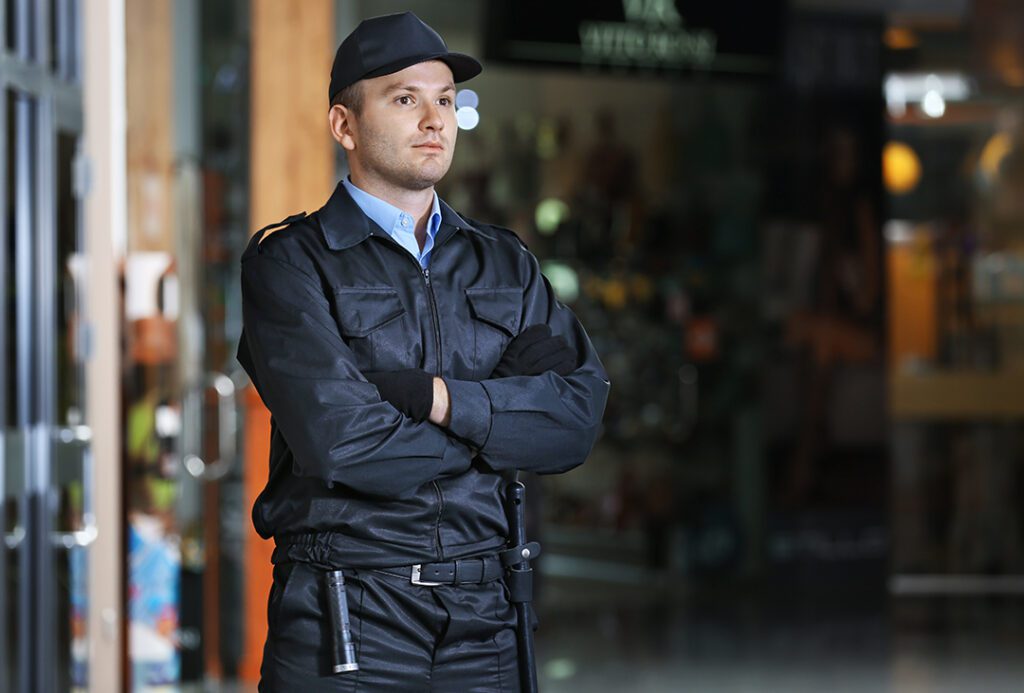 security man standing with arms crossed